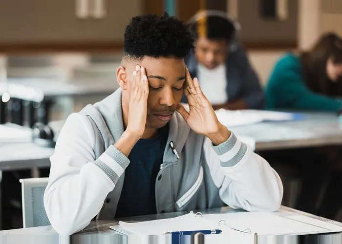 Teen boy is stressed about test.