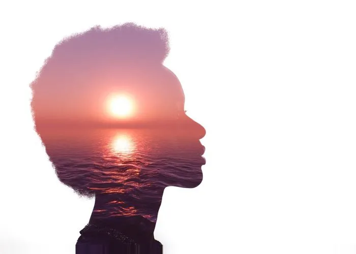 Multiple exposure image with sunrise and sea inside woman silhouette. Psychology concept