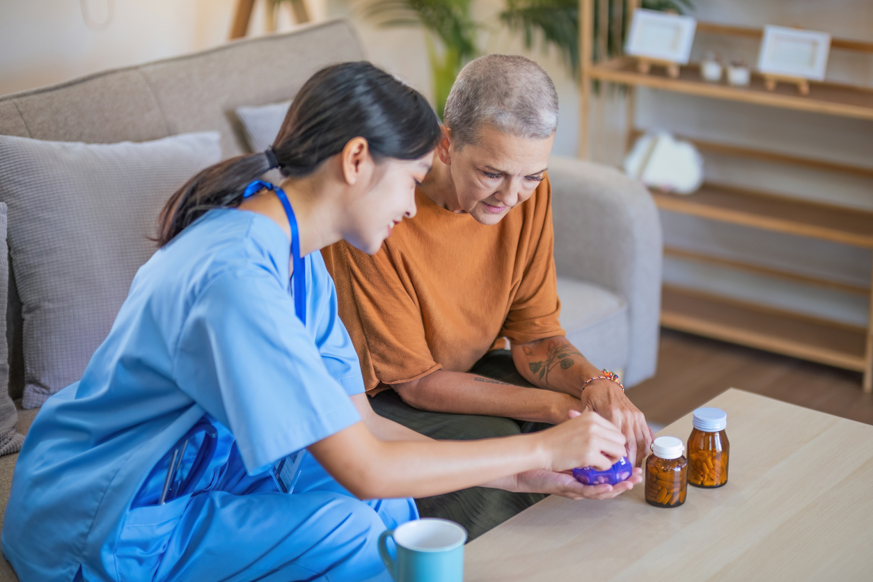 elderly woman managing her medication with a doctor.
