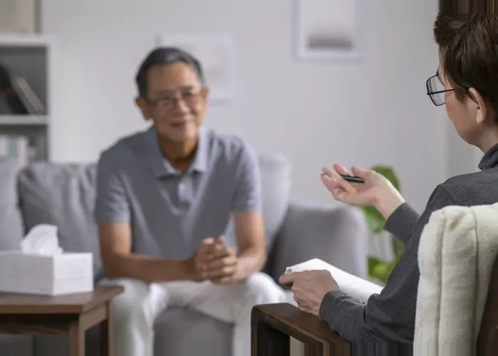 Senior patient with mental health problem talking and consulting therapist